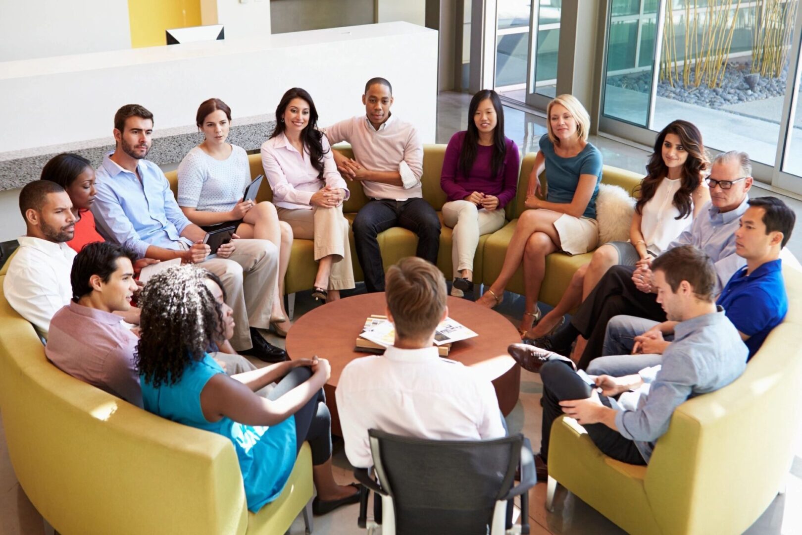fm=f 2943 A group of people sitting around each other in a circle.